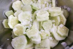 sliced up cucumbers in a metal bowl