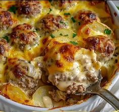 a casserole dish with meatballs and potatoes in it on a white plate