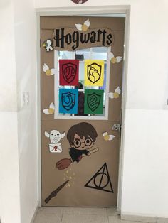 a door decorated with harry potter and hogwart's symbols