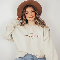 Celebrate your Soccer Mom Era in style with this cozy, minimalist sweatshirt, perfect for cheering on from the sidelines. Featuring a chic, preppy design with hints of Old Money Aesthetic, this sweatshirt blends comfort and class for the ultimate soccer mom look. Ideal as a thoughtful gift for mom, this shirt makes a great present for birthdays, holidays, or just because. Join the Sideline Social Club and show your soccer spirit in clean, timeless style! 🛒 HOW TO ORDER 1.Please check and review all photos 2.Select your sweatshirt color and size from the drop-down menu 3.Choose your quantity  4.Click "add to cart", then feel free to go back and add more of your favorite items 5.Check out and wait for your package to arrive!  ...Small business happy dance in progress 💃💕 ❤ NEW ARRIVALS -Cl Everyday Fleece Tops With Letter Print, Fleece Tops With Letter Print, Preppy Soccer, Minimalist Sweatshirt, Cozy Minimalist, Soccer Mom Shirt, Minimalist Preppy, Mom Era, Money Aesthetic