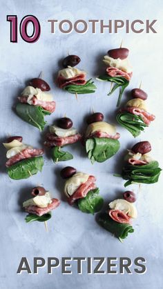 small appetizers with meat, cheese and olives arranged in the shape of a circle