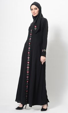 Featuring an elegant A line silhouette long flowy abaya dress in nida fabric adorned with multicolor floral embroidery at the centre front and sleeves. It has round neckline and princess seams for the comfortable wear causally.FIT : Relaxed fit.COMPOSITION : Nida.CARE : Dry clean only. Elegant Black Abaya With Floral Embroidery, Black Long Sleeve Abaya With Floral Embroidery, Black Thobe With Floral Embroidery And Long Sleeves, Black Long Sleeve Thobe With Floral Embroidery, Black Abaya With Floral Embroidery, Black Abaya With Resham Embroidery For Eid, Black Embroidered Floor-length Abaya, Modest Black Kaftan For Eid, Eid Embroidered Long Sleeve Dress