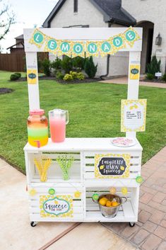 an outdoor lemonade stand with drinks on it