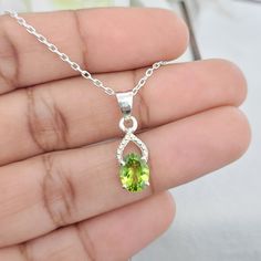 This Pendant is made from 925 Sterling silver. This Pendant is finely polished to give a brilliant mirror finish. With rejuvenating design and sleek appearance, this Pendant looks stunning on You. Material :- Silver (925 Solid Sterling Silver) Gemstone:- Natural Green Peridot Item Weight :- 1.05 gm Approx. Stone Shape :- Oval Cut Gemstone Size :- 6 MM X 8 MM For Matching Stud :-https://www.etsy.com/listing/1092086206 Payment Policy :- We accept payment through PayPal. All payments must be made within 7 days of purchase. If you are experiencing some difficulty in paying through PayPal and need additional time, please contact us. Shipping Policy :- All Item will Be Shipped Through India Post International within 1-3   Business Days after Received Payment. Shipping Charges :-  USA Shipping Ch Oval Peridot Gemstones For Anniversary, Sterling Silver Oval Pendant Gemstones For Anniversary, Silver Peridot Oval Jewelry, Silver Oval Peridot Jewelry, Oval Peridot Silver Jewelry, Oval Hallmarked Peridot Jewelry, Hallmarked Oval Peridot Jewelry, Oval Silver May Birthstone Gemstones, Peridot Pendant