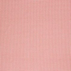 an orange and pink checkered fabric with small squares on the front, as well as a white background