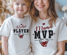 "\"Mama and Mini\" football shirts celebrate the unique and precious bond between a mother and her little one. These matching shirt sets are designed to highlight the special relationship between a mother and her child, often featuring coordinated designs that evoke warmth, love, and affection. These shirts are perfect for everyday wear, family outings, special occasions, or even as adorable photo props for capturing cherished moments together. \"Mama and Mini\" shirts not only showcase the inse Matching Tops For Family Events On Mother's Day, White Top For Mother's Day Family Events, Mama And Mini Shirts, Mini Outfits, Mini Shirts, Matching Family Shirt, Mini Football, Mini Outfit, Mini Footballs