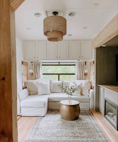 a living room filled with furniture and a flat screen tv