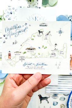 a person holding up a card with the map of martha's vineyard on it