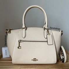 100% Authentic Brand New With Tags Coach 79316 Pebble Elise B4/Ivory And Gold Hardware Approximate Measurements: 9.5”Bottom, 12"Top (L) X 8.5" (H) X 4" (D) Handles With 5.5" Drop Long Strap Included Elegant Coach Bags In Neutral Color, White Workwear Satchel With Top Carry Handle, Cream Coach Bags For Office, Everyday Coach Cream Satchel, Everyday Cream Coach Satchel, Chic Beige Coach Satchel, Coach Cream Satchel With Double Handle, Coach Cream Satchel With Detachable Handle, Coach Beige Double Handle Satchel