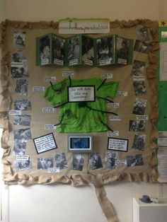 a bulletin board covered in pictures and papers