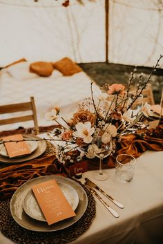 the table is set with plates and silverware