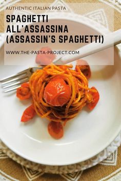 spaghetti alla'assasina with red sauce on a white plate and the words authentic italian pasta