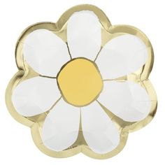 a white and yellow flower shaped object on a white background