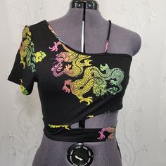 Details: - Rainbow Dragon Design - Short Sleeve - Off-The-Shoulder Design - Cropped - Lightweight - Stretch - Nwt ( New With Tag) Brand: Love J Size: L ( Fits Like A Medium) Approx.: 16" Pit To Pit 15" Length 10" Sleeve Comment For More Details! Don’t Be Shy! Send Me Offers!!! Bundle Items For Better Deals I Can Ship All Items Out A.S.A.P Please Read Descriptionto Help Form Your Own Opinion On The Items Condition. Thanks, Anna =) Shop My Closet For: Boho Bohemian Hippie Tie Dye Spring Summer Seq Yellow One Shoulder Top For Summer, Fitted Multicolor One Shoulder Top, Black One Shoulder Crop Top For Summer, Black One-shoulder Crop Top For Summer, Black Fitted One Shoulder Top For Summer, Trendy Black One Shoulder Top For Summer, Casual Black One Shoulder Top For Spring, Neon Festival, Rainbow Dragon