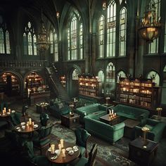 the interior of a library with green couches and tables