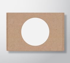 a piece of cardboard with a white circle on it