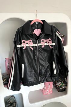 This jacket features playful pink bow patches that adorn it, giving it an irresistible coquette and soft girl charm.

The pink and white stripes give it a girlish cuteness and the slightly oversized fit adds a touch of casual sophistication.

Color: Black
Faux leather material
Zippered pockets
Fits true to size (U.S. women's size) Pink Harajuku Style Outerwear For Spring, Harajuku Pink Outerwear For Spring, Pink Harajuku Outerwear For Spring, Pink Harajuku Outerwear For Fall, Cute Pink Outerwear For Streetwear, Pleather Jacket, Glamour Vintage, Pink Leather Jacket, Textil Design