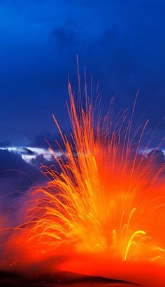 an orange and blue volcano with lava spewing out