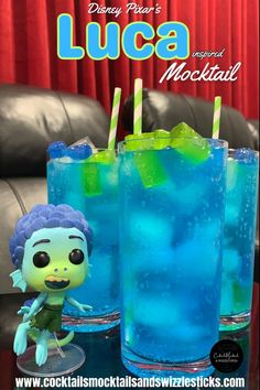 This image shows three tall blue drinks with green and blue jolly ranchers on top with green and white striped straws with a Luca figure from the movie Luca in a home theather Disney Themed Drinks, Family Movie Night Snacks, Luca And Alberto, Disney Themed Movie Night, Disney Movie Night Food, Disney Cocktails, Disney Movie Night Dinner, Movie Night Dinner, Disney Inspired Food