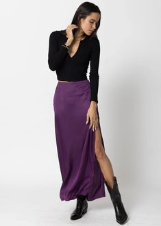 A CLOSET STAPLE, A SILKY MAXI SKIRT WITH HIGH SLIT.  ADD TO CART  THE DANI SKIRT IS SUPER FLATTERING AND COMFORTABLE.  PAIR WITH ANY OF OUR CROP BASIC TANKS...  ADD A CASHMERE SWEATER OVER OUR SHOULDERS FOR ELEVATED DRESS-DOWN STYLE. Closet Staples, Top Sales, Cashmere Sweater, Dressed Down, Basic Tank, Deep Purple, Cashmere Sweaters, Jumpsuit Dress, Dresses For Sale