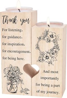 two wooden candles with the words thank you and an image of a flower arrangement on them