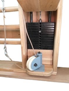 an old fashioned wooden clock with black and white dials