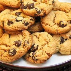 a plate full of chocolate chip cookies on a table