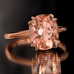 This exquisite and stunning ring is one you might see walking down the red carpet. She will be swept away with its simple but elegant tulip design and setting perfectly featuring a generous, feminine peachy-pink Morganite stone. Sure to catch all eyes, this is that ring that truly cannot be ignored! Morganite Rose Gold Ring, Rose Gold Morganite Ring, Rose Gold Morganite, Morganite Engagement, Pink Morganite, Morganite Engagement Ring, Morganite Ring, Rose Gold Band, Creating Jewelry