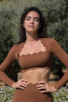 Why We Love It： Achieve a charming look with the WISKII scallop cropped long sleeve top. Made from ultra-soft fabric, it showcases a half-moon scalloped edging that beautifully accentuates your body, effortlessly pairing with any of your favorite bottoms. Fit and Features： Long sleeve Scallop detail Removable push-up paddings Classic Length: cut above the waist Colour: Roasted Cocoa, Ivory White, Black, Sunset, Pink Hollywood, Sage The model is 5’9”, with a 33” bust, 24” waist & 36” hips – she w Short Blanc, Short Noir, Yoga Jacket, Cropped Long Sleeve Top, Cropped Long Sleeve, Pink Shorts, Ivory White, Chic Design, Black Shorts