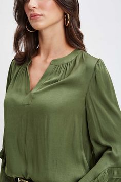 It's all in the details. Romantic & feminine, our long sleeve shirt features a split tie neckline & pleated bodice detailing. With its long blouson sleeves & effortless fit, this style is a year-round essential. T-Tahari Long sleeve Airflow Blouse with Pleat Detailing & Blouson Sleeves Runs true to size Model is 5'9" and wearing size S Dry Clean Only Imported Style #: THF48008 Solid Color Viscose Blouse For Fall, Solid Viscose Blouse For Fall, Viscose Long Sleeve Office Tops, Chic Blouse With Split Neck And Relaxed Fit, Chic Split Neck Blouse With Relaxed Fit, Chic Relaxed Fit Blouse With Split Neck, Casual Blouse With Blouson Sleeves And Tie Neck, Elegant Rayon Blouse For Fall, Fall Blouse With Blouson Sleeves And Split Neck