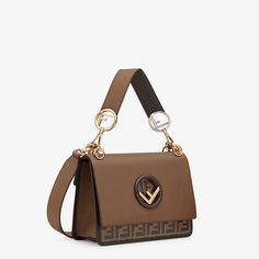 Description Bag with flap and new Fendi logo. Magnetic closure. Gusseted interior with a pocket. Can be cross-body or carried in the hand thanks to the detachable shoulder strap. Made of brown leather. A mix of palladium-finish and gold-finish metalware. Size: 9.8 x 7.1 x 4.1 inches / 25 x 18 x 10.5 cm 100% genuine materials, matching the quality of the Fendi product; Composition:100% Calf leather, inside: 60% Polyamide, 40% Polyurethane Comes with dust bag and ations Gucci Luggage, Fendi Kan I, Fendi Store, Fendi Shoulder Bag, Fendi Bag, Fendi Handbag, Fendi Logo, Luxury Purses, Brown Leather Bag