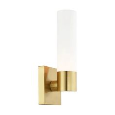 a brass wall light with a white glass shade