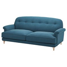 a blue couch sitting on top of a white floor