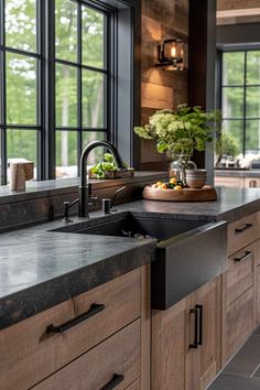 a large kitchen with wooden cabinets and black counter tops, along with an open window