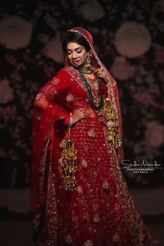 a woman in a red bridal gown