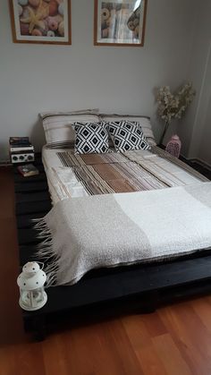 the bed is made up and ready for someone to use it in their home or office