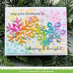 an ornament hanging from a christmas tree with the words merry and bright written on it