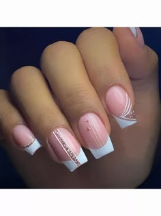 a woman's hand with pink and white nail polishes on her nails, which are