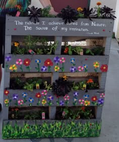 Pallet Planter Art Project. 1st Grader handprints make grass at bottom, and fingerprints for flowers. Buttons nailed in centers of flowers. Herbs and succulents planted. (Spray primer-paint and spray-sealed after hand paint.) Backed with burlap. Shelves cut and nailed in before starting paint. Art Projects For Kids Preschool, Auction Project Ideas