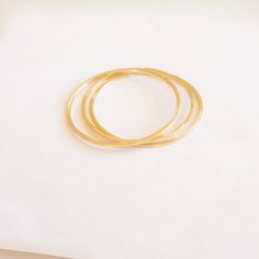 A simple and minimalistic 2mm bangle. Perfectly capable of riding solo or a great piece to pile on with your other favorites. These bangles are forged from sturdy copper, brass or solid sterling silver. Delicate eye catchers! Perfect for everyday. Measure the with of your closed fist from the top center of one knuckle to the other. Select the closest bangle size. Please view the last picture on this listing that shows how to measure for your correct size as there will be a charge for size exchan Minimalist Bangle Bracelet With Simple Design, Nickel Free Minimalist Round Bangle, Minimalist Nickel-free Round Bangle, Minimalist Stackable Hoop Bangle, Minimalist Nickel Free Bangle Bracelets, Nickel-free Minimalist Bracelet Bangle, Minimalist Nickel-free Bangle Bracelets, Nickel-free Minimalist Bangle, Minimalist Stackable Round Bangle