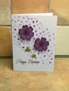 a birthday card with purple flowers on it