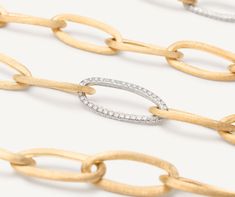 This bold and elegant long necklace features a balanced play of full and empty volumes. The chain is made up of oval elements in 18K yellow gold, finely hand-engraved using the ancient Florentine technique which gives our gold a fine, brushed texture. The necklace is further embellished with three pav�é links of brilliant-cut diamonds. Sara Sampaio, The Chain, The Ultimate Gift, Gold Collection, Diamond Sizes, High Jewelry, Link Necklace, Hand Engraving, Brilliant Cut Diamond