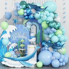 an ocean themed birthday party with balloons and decorations