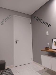 a room with a white door and gray walls