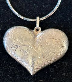 Puffed Italian Sterling Silver heart pendant necklace on a 18" sterling chain that has been etched on both sides in a lovely floral pattern. 925 mark on hanging loop. Silver Heart Aesthetic, Valentine's Day Engraved Flower Pendant Necklaces, Silver Etched Necklace For Valentine's Day, Valentine's Day Silver Etched Necklace, Vintage Sterling Silver Heart Pendant Necklace, Silver Heart-shaped Etched Necklace, Etched Heart Silver Necklace, Heart-shaped Etched Necklace For Keepsake, Etched Heart Pendant Necklace For Valentine's Day