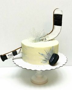 a cake with a shoe on top that is decorated to look like an ice hockey goalie