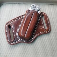 the inside of a leather case with a knife in it