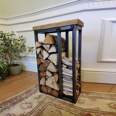 a stack of firewood in a wooden crate on the floor