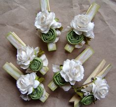 six pieces of green and white flowers with ribbons