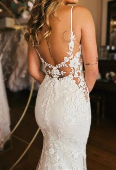 a woman in a wedding dress looking back